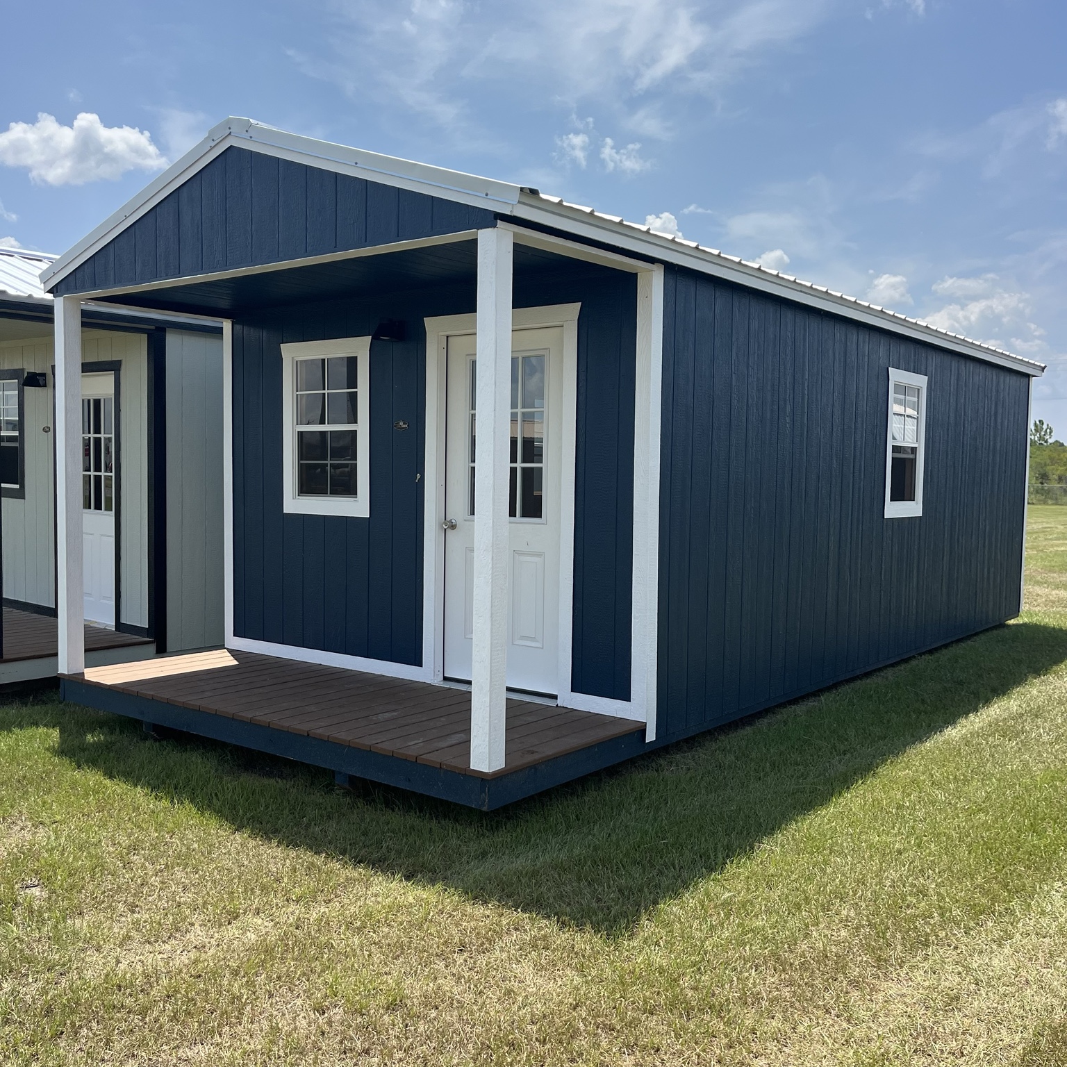 Blue portable cabin with porch